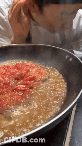 Man Smelling Tomato Pan GIF