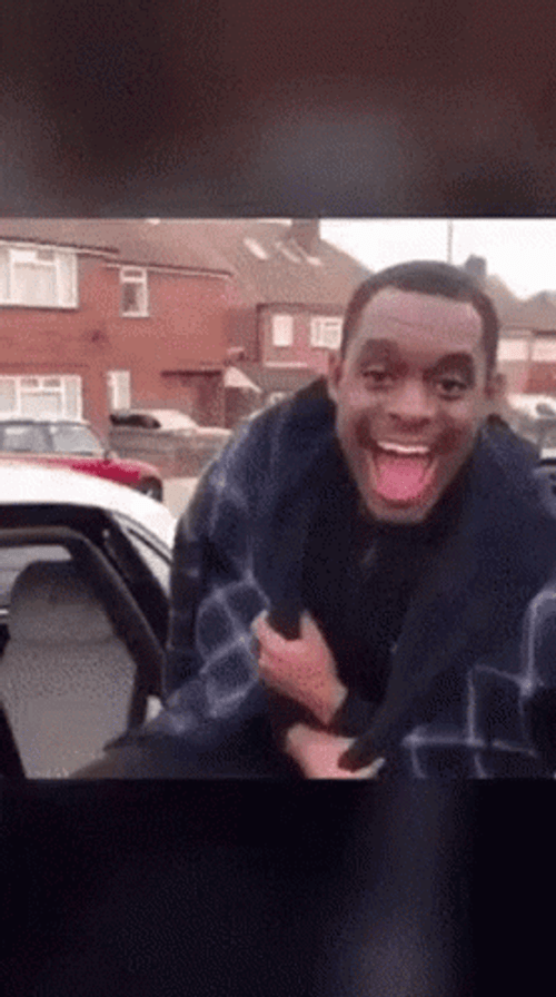 Man Smile Into His Car GIF