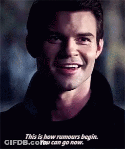 Man Smiling And Talking About Rumors GIF