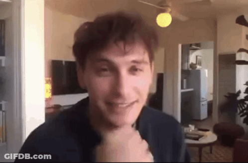 Man Smiling At Camera In Living Room GIF