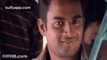 Man Smiling At Camera On Bus GIF