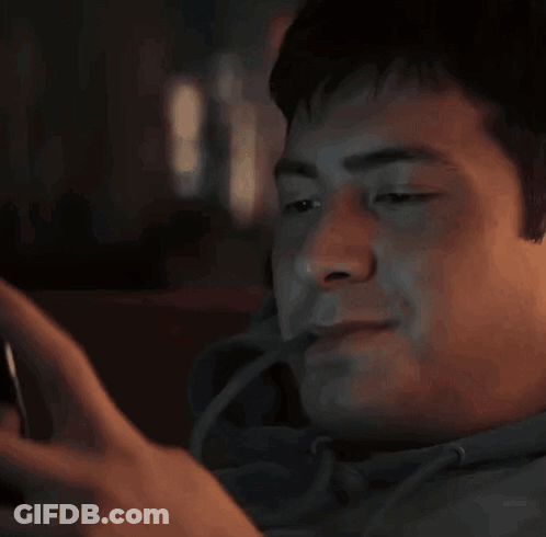 Man Smiling At Cell Phone GIF