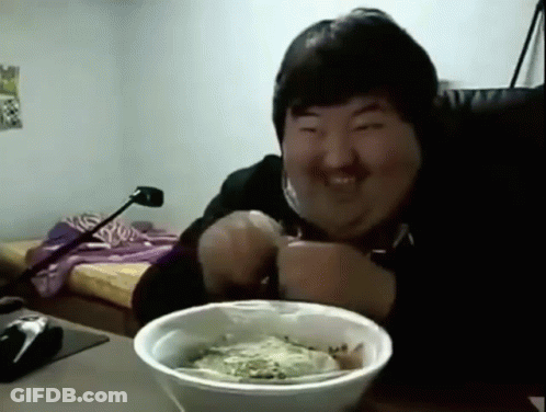 Man Smiling At Table With Bowl Of Food GIF