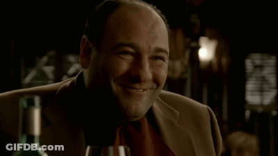 Man Smiling At Wine Bottle GIF