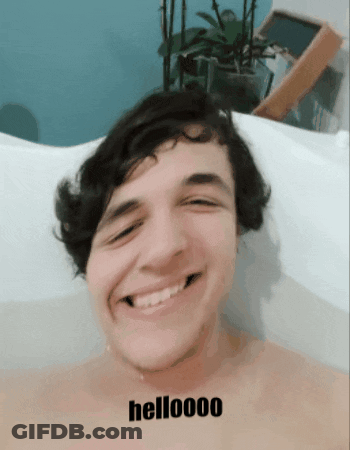 Man Smiling In Bathtub Saying Helloooo GIF
