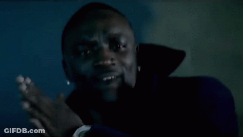 Man Smiling In Dark Room GIF