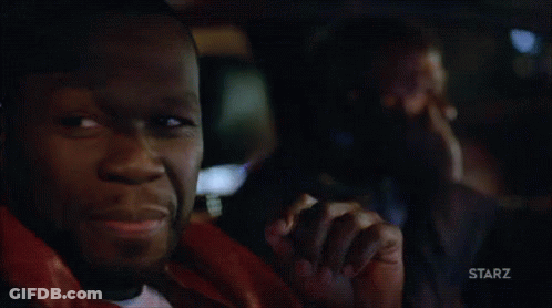 Man Smiling In Dark Room With Starz Logo GIF