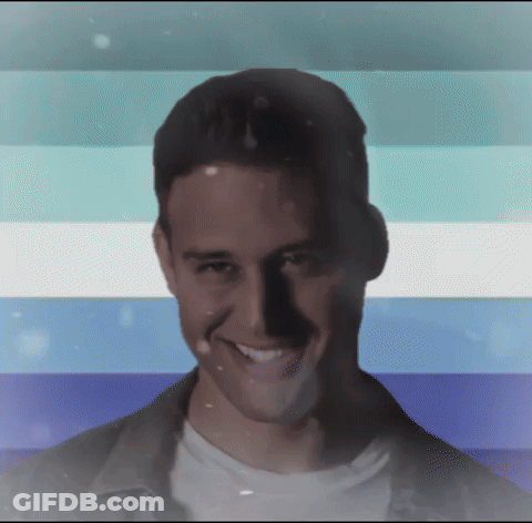 Man Smiling In Front Of Blue White And Green Striped Background GIF