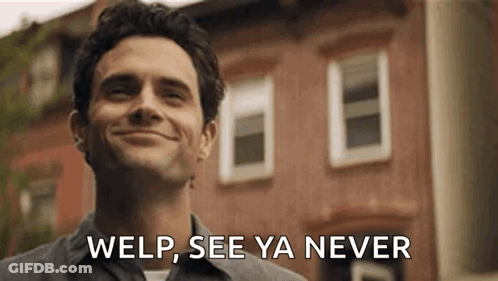 Man Smiling In Front Of Brick Building GIF