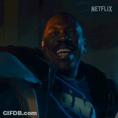 Man Smiling In Front Of Brick Wall Netflix GIF
