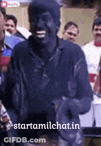 Man Smiling In Front Of Crowd GIF