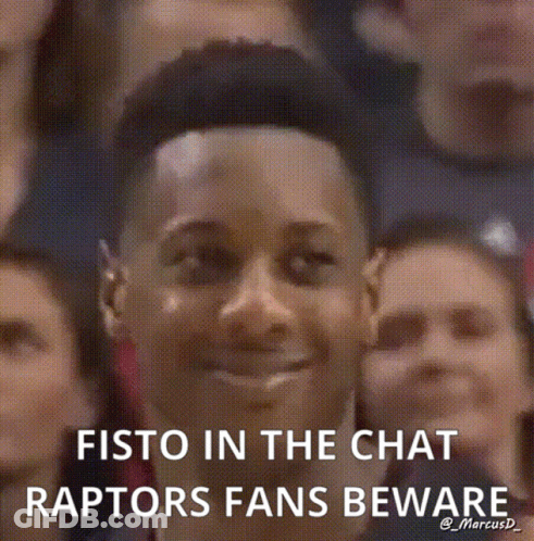 Man Smiling In Front Of Crowd Saying Fisto In The Chat Raptors Fans Beware GIF