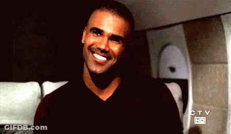 Man Smiling In Front Of CTV Sign GIF