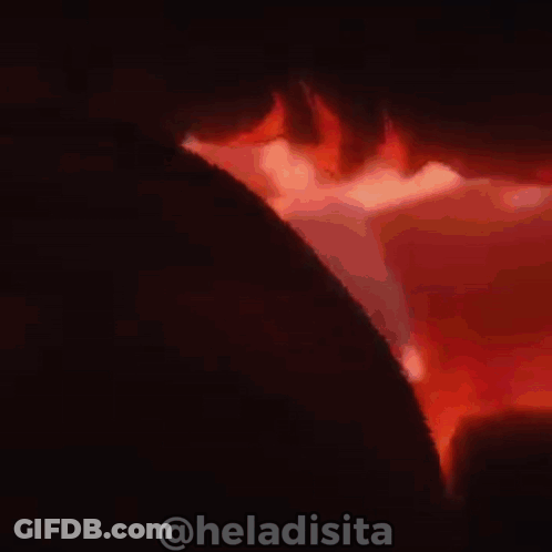 Man Smiling In Front Of Fire GIF
