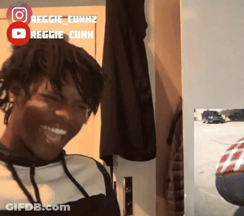 Man Smiling In Front Of Reggie Cuhk Sign GIF