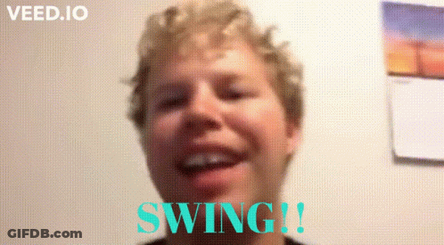 Man Smiling In Front Of Swing Wall GIF