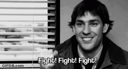 Man Smiling In Front Of Window Saying Fight Fight Fight GIF