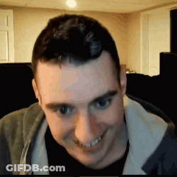 Man Smiling In Grey Jacket GIF
