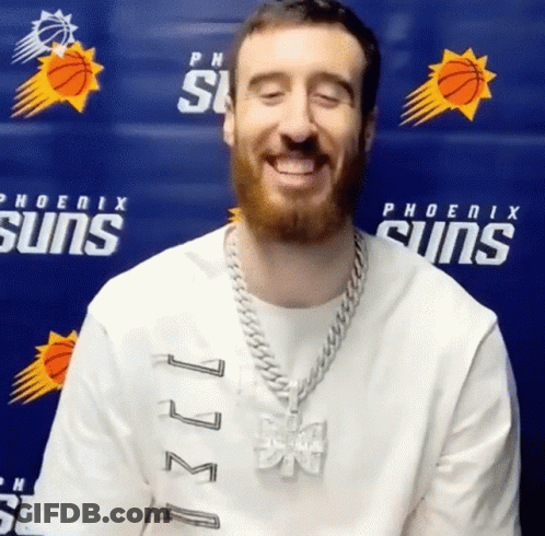Man Smiling In Phoenix Suns Shirt Blue Wall GIF