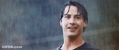 Man Smiling In Rain With Wet Hair GIF