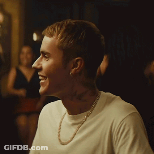 Man Smiling In White T-Shirt And Gold Chain GIF