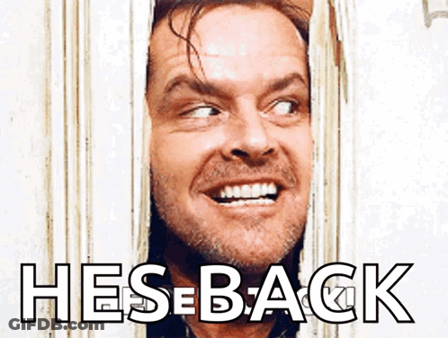 Man Smiling Looking Through Door Hes Back GIF
