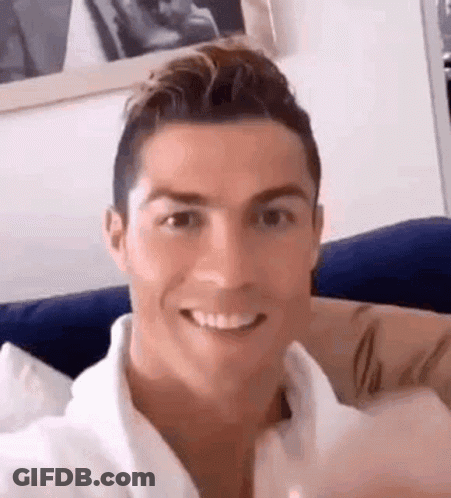 Man Smiling On Couch GIF