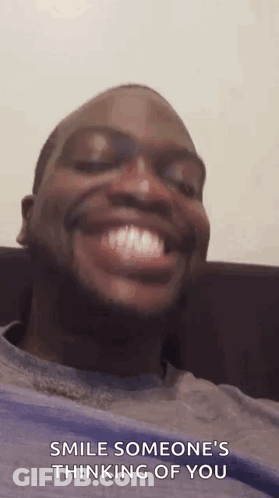 Man Smiling On Couch Saying Smile Someone's Thinking Of You GIF
