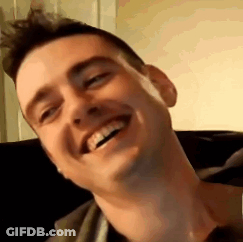 Man Smiling On Couch GIF