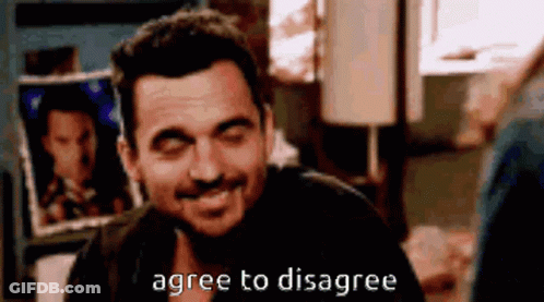 Man Smiling Saying Agree To Disagree GIF