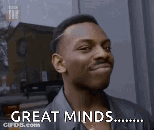 Man Smiling Saying Great Minds GIF
