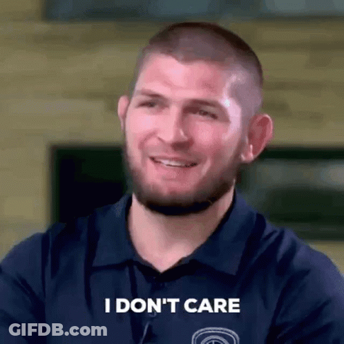 Man Smiling Saying I Don't Care GIF
