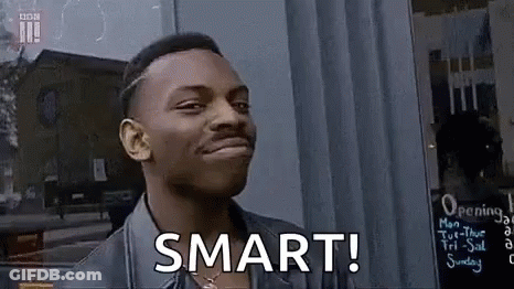 Man Smiling Saying Smart In Front Of Store GIF
