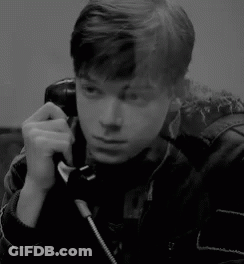 Man Smiling Talking On Phone GIF