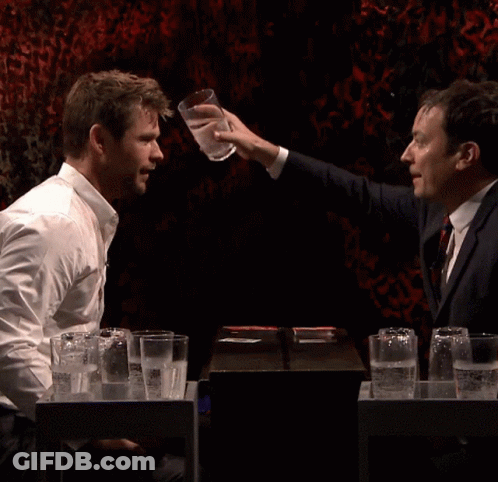 Man Smiling While Water Is Poured GIF