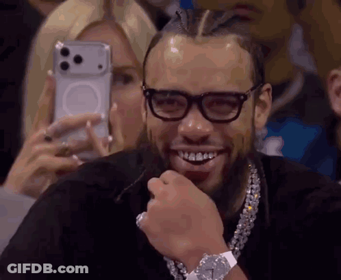 Man Smiling While Woman Takes Photo GIF