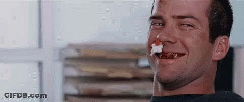 Man Smiling With Cake In Mouth GIF