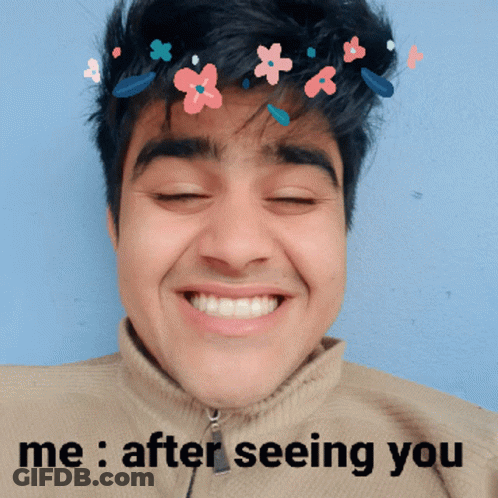 Man Smiling With Flowers In Hair Saying Me After Seeing You GIF