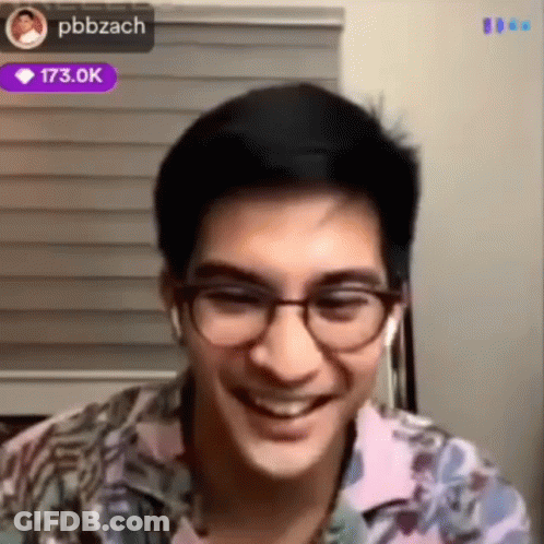 Man Smiling With Glasses And Earbuds GIF