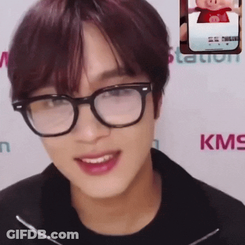 Man Smiling With Glasses Next To KMS Logo GIF