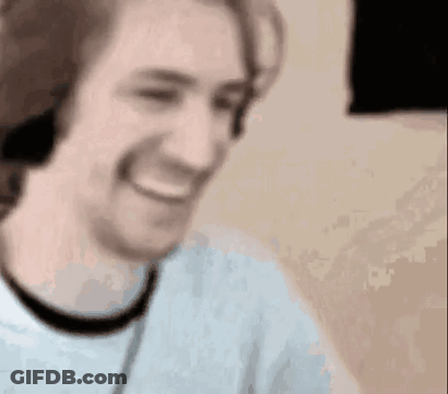 Man Smiling With Headphones GIF