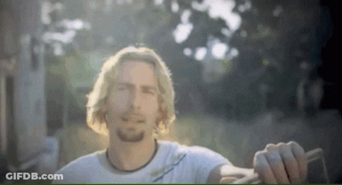 Man Smiling With I'm A Traitor Behind Him GIF