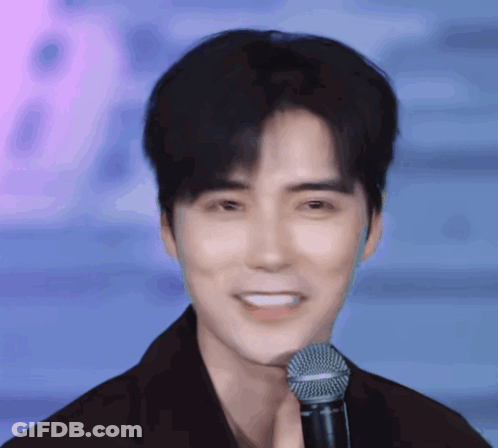 Man Smiling With Shure Microphone GIF