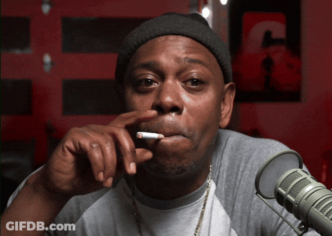 Man Smoking At Microphone With Letter C GIF
