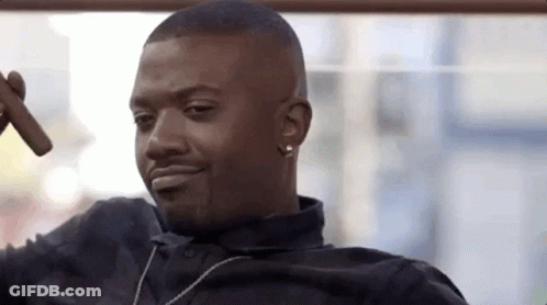 Man Smoking Cigar And Smiling With Necklace GIF
