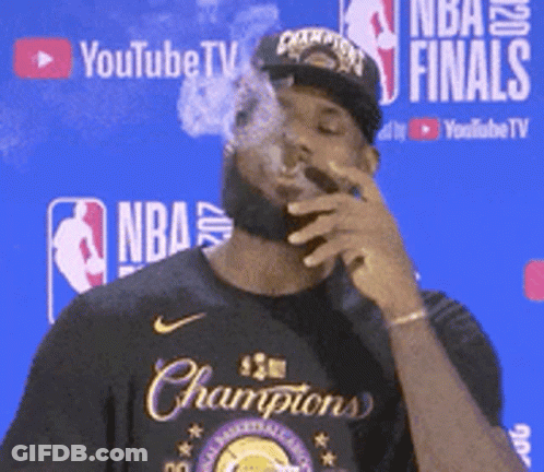 Man Smoking Cigar At YouTube TV Sign GIF