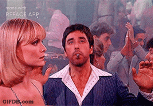 Man Smoking Cigar While Woman Watches GIF