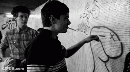 Man Smoking Cigarette Drawing On Wall GIF