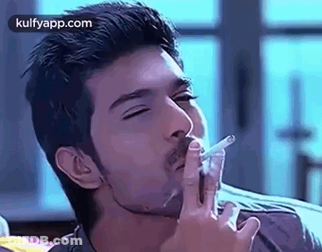 Man Smoking Cigarette Eyes Closed Mouth Open GIF