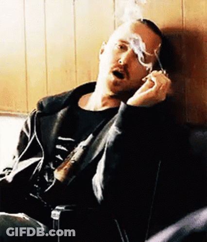 Man Smoking Cigarette In Chair GIF